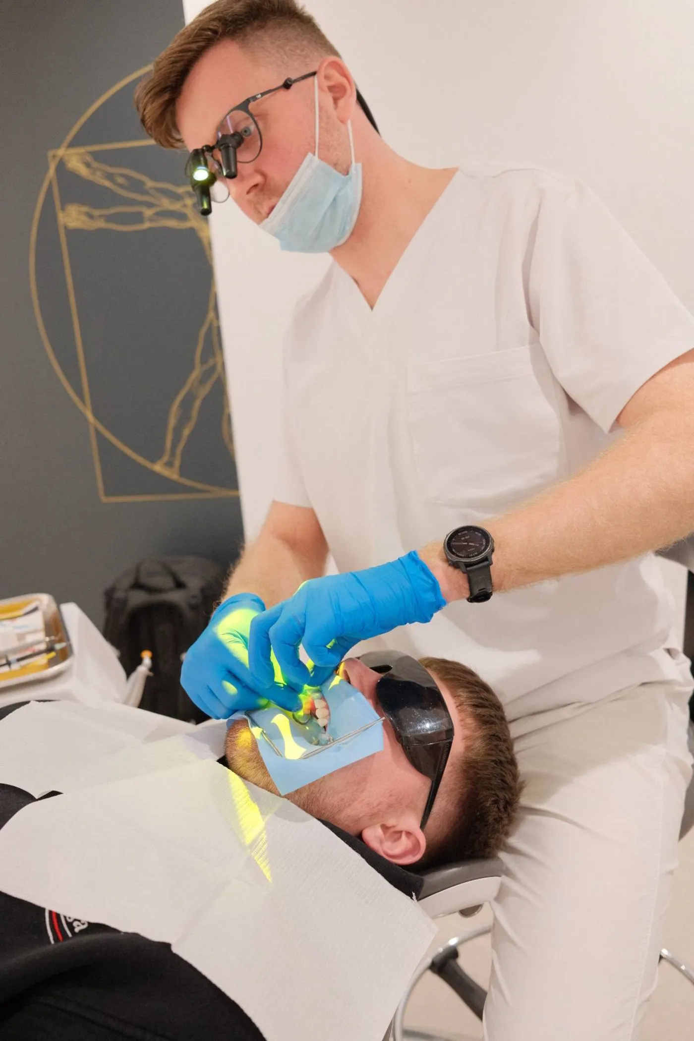 Dr Tristan Tinn working under magnification loupes during a treatment appointment