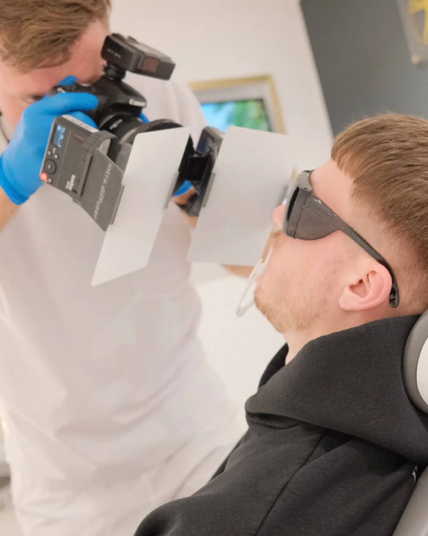 Clinical photography setup with intraoral mirrors and ring flash at Crossbank